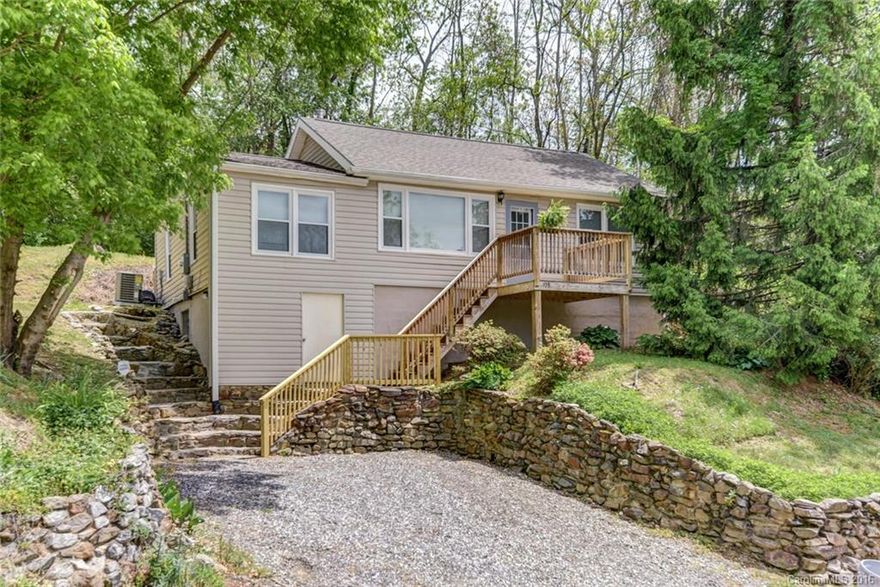 3 bed 1.5 bath home with sunset views positioned conveniently close to UNCA in Woodfin. With an abundance of basement storage for a workshop or the outdoor enthusiast, wood and vinyl flooring, updated windows, and a refreshing subway tile bath this home lives large. Large kitchen and  a smaller third bedroom is perfect for nursery or office.This home is a rare combination of incredible features not common at this price point. Easy to show and ready for a new owner or investor.