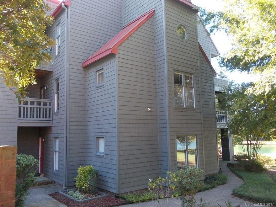 This 2nd story updated condo features 2 bedrooms, office, 2 full bathrooms and nearly 1300 square feet. Formal dining room, living room with access to large deck and spacious kitchen with breakfast area. Master bedroom has w/i closet, updated vanity and tub. This unit also has a unique craft loft above the kitchen. The view is great from this condo, one side looks out over community pool, the other side looks out over the University Lake. Walk to popular restaurants, shops, UNCC and Lightrail.