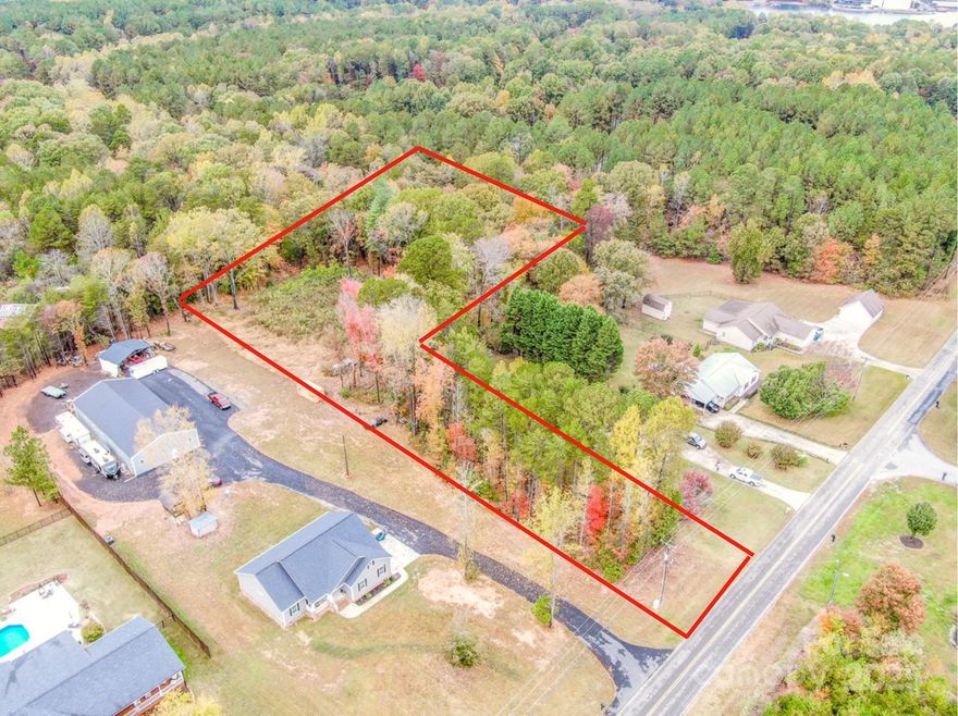 Multiple Offers - Best offers due by Sunday, Nov 2nd @ 12PM. This beautiful 2.44-acre property is close to Lake Norman with easy access to several public boat launches. Conveniently located near the heart of Denver and Sherrills Ford, with easy access to Uptown Charlotte and Charlotte Douglas Airport. The perfect setting to build your dream barndominium or home surrounded by mature trees with no HOA restrictions. There are two building sites —ideal for a multigenerational property or home with a detached shop. The land is shaped like an “L,” providing approximately 75 feet of road frontage and about 30 feet for driveway access. The rear portion opens up to a large, cleared area of roughly 100’ x 100’. A soil test has been completed. Low Catawba County taxes and in a desirable school district. Do not park in the asphalt driveway while looking at the property.