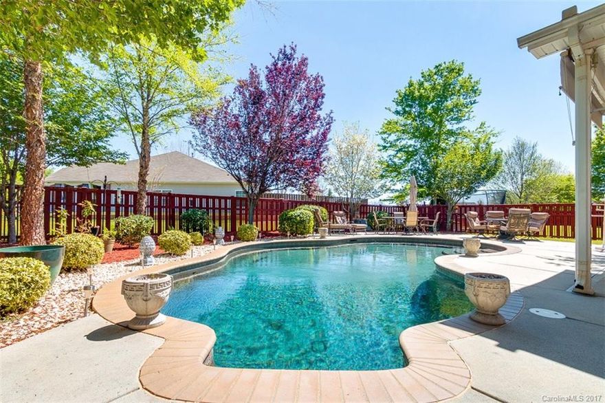 Beautiful Home w/ In-Ground Pool & Outdoor Entertaining Area is a Dream come true! Features include Full Irrigation System, Wood Floors, & 20" Kitchen Tiles. Fabulous Open Concept floor plan offers Crown Molding, beautiful Kitchen that includes SS Appls featuring Bosch Dishwasher & Kitchen Aid Convection Stove/Oven, 42" Raised Maple Cabinets & fantastic work Island. Upstairs has 4 bedrooms & large Loft that is full of light from windows & overlooks beautiful backyard Oasis. Rare find in Ft Mill!