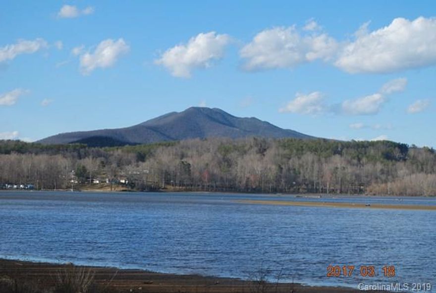 Lake James living-don't pass up an opportunity that allows lakefront property at an affordable price.  This 2.347+/- acre lot has approximately 502 feet of Lake James access with paved state road frontage.  Duke Power will not issue a boat dock permit for this lot however you moor a vessel or beach boats/watercraft vessel on the shoreline.  Septic & well permit already obtained by seller.  Mobile homes, campers etc. are not allowed, however small cabins or homes are.