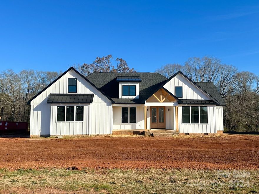 Introducing this spacious new construction home in Edmunds Farm. This beautiful home features an open floorplan with the kitchen, living, and dining area splitting the bedrooms.  Kitchen has island with seating, custom range hood and huge walk-in pantry. Enjoy the craftsmanship with the shiplap on fireplace, coffered ceiling, wall sconces, wainscotting throughout and vaulted ceiling in living room. Primary bathroom features dual vanities, soaking tub, and custom tile shower including dual shower heads and a rain head. Right off bathroom is his and hers walk in closets with built ins already installed. Primary closet attaches to laundry room so life is just a tad bit easier! Covered front and rear porch with cedar ceilings make this the perfect spot for entertaining! Don't miss this opportunity! Builder also installs pools, so the septic was placed toward rear of property to allow a pool to be installed in future. Additional info regarding the pool can be shared to interested parties.