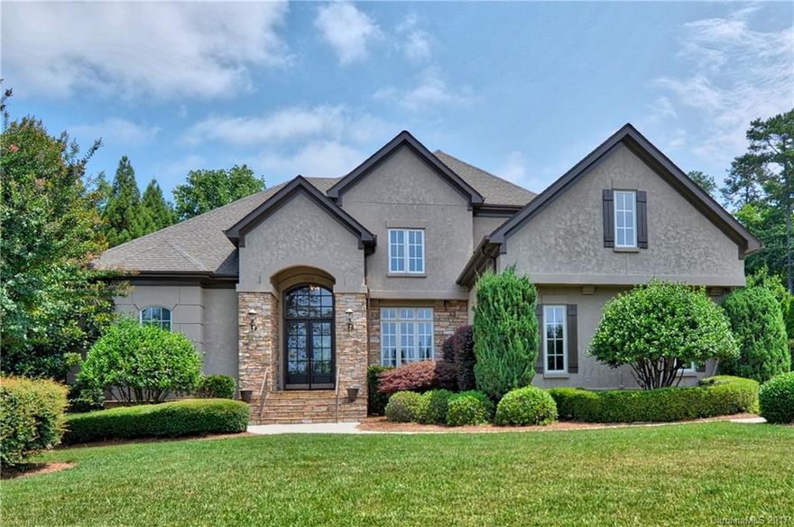 Breathtaking curb appeal w/hard coat stucco & stone.Great culdesac location w/amazing waterviews & short walk to Yacht Club.Extravagant entry,elegant dining room w/extensive trim,spacious great room w/coffered ceiling & beautiful fireplace w/custom builtin cabinets.High end gourmet kitchen w/double wall ovens, island w/gas cooktop,built in refrigerator,granite counters & tile backsplash. Huge 2nd floor w/3large bedrooms,3fullbaths & bonus room.Wonderful outdoor living area w/screen porch & deck.