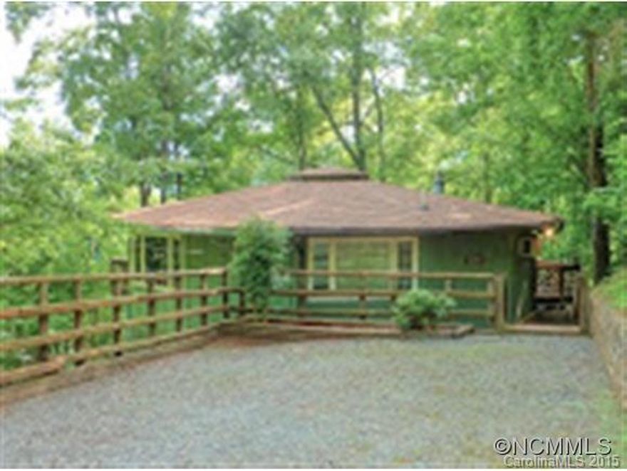 Wonderful rustic getaway with year-round views.  Perfect as a vacation home or as a rental property.  Relax and experience mountain evenings on the wrap-around-deck.  New roof, new bathroom, new plumbing and electric upgrades.  This homes makes mountain living affordable.  Enjoy the Rumbling Bald amenities including 2 golf courses, 3 pools, beach, marina, tennis, fitness area and spa.