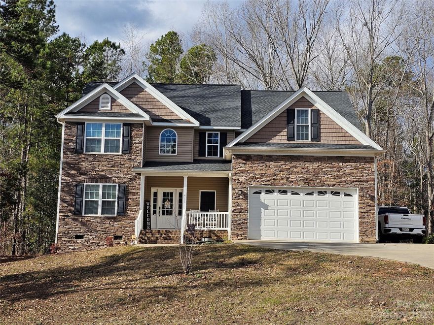 This great home is back on the market at no fault of the sellers.  Come and enjoy all this home has to offer. Welcoming 2 story foyer into the beautiful 2 story great room with fireplace. Kitchen has granite counter tops, stainless steel appliances, breakfast bar and dining area. There's also a built in desk in the dining area. Formal dining room. One of 4 bedrooms is located downstairs along with a full bath.Upstairs you have a large primary bedroom and bathroom, large walk-in closet. 2 additional bedrooms and a bath with the laundry room upstairs. Deck for grilling, and a 2 car garage.