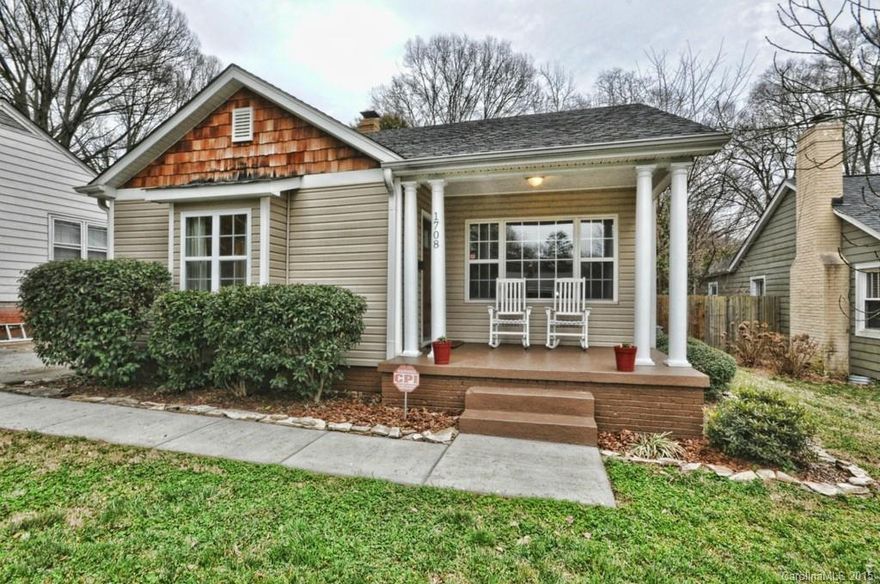 Renovated home on wonderful street in Midwood! Three bedrooms and two full baths.  Kitchen open to living area with see through ventless fireplace between dining room and den.  Master suite addition with large walk-in closet and attached bath with dual sinks and garden tub.  Vaulted ceilings in den.  Hardwood floors throughout.  Rocking chair front porch.  Rear deck and fenced rear yard. Recessed lighting.  Kitchen with stainless steel appliances and granite.  Loads of natural light.