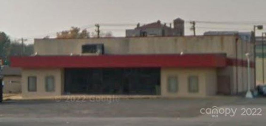 Begin with the end in mind and make this building into whatever you envision. You couldn't build this for the asking price!! This site built 9000 +/- sqft  masonry building will make a great space for a business that's opened to taking on the project of gutting the inside, replacing the side doors that may have contributed to the water intrusion that caused the floors to deteriorate over time. This building is being sold As Is Where Is. Buyers are encouraged to do inspections and to be careful when entering the theater part of the building as floors are unsteady. Anything left in the building will convey with the building. Professional Measurements will be completed at the end of the week. Current measurements are based on the tax record. Current zoning is central commercial district. Year built is approximate.