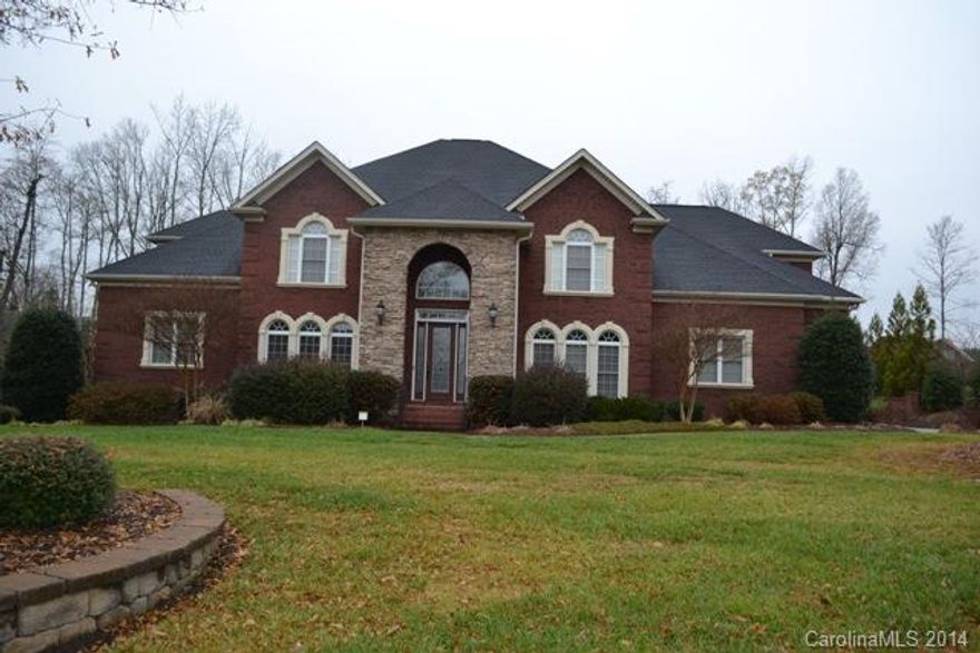 Stunning brick home with all the bells and whistles! Soaring entry with beautiful staircase!  Formal areas, huge granite kitchen with island, double oven, stainless appliances.  Two story great room with built-ins and fireplace/gas logs. Large master on main with fireplace/sitting area. 5th bedroom could be used as an office. Huge bonus room, sun room, screen porch and large patio area. Central vac, tons of closets! Neighborhood amenities include pool, club house, tennis courts & walking trails!