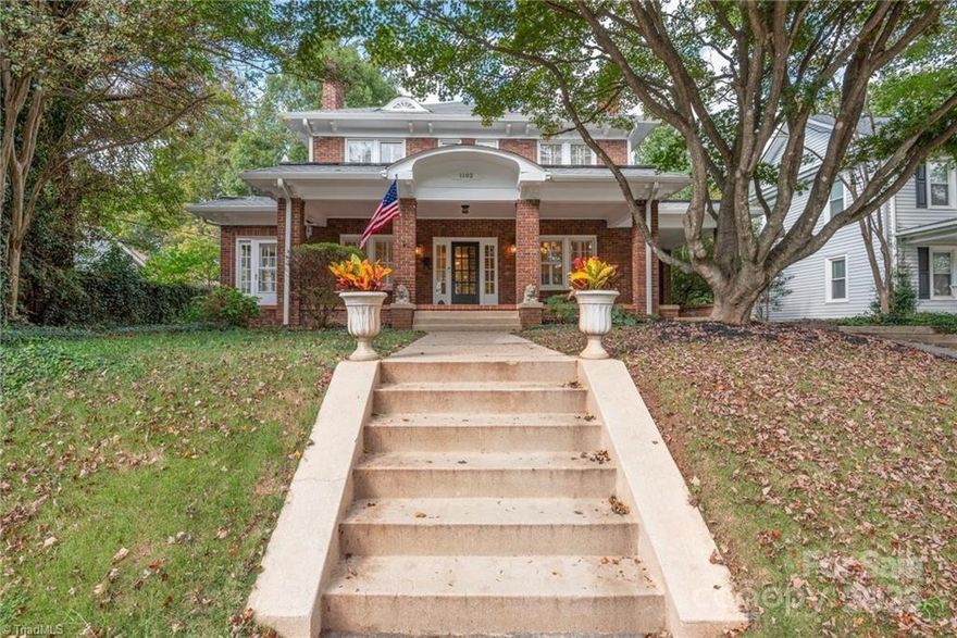 Stately brick beauty on iconic S Hawthorne in historic Ardmore—a sidewalk, front-porch neighborhood minutes to both major hospitals, Hanes Park, Cloverdale/Thruway shopping & dining, and Downtown W-S. A wide, welcoming wrap porch sets the tone; inside, light-filled rooms showcase hardwoods, tall ceilings, French doors, fireplaces, and classic millwork. The main level offers an expansive flex room beside a full bath—ideal for a main-level primary suite, studio, or playroom. Upstairs you’ll find four bedrooms and a full bath. Sunny kitchen with abundant cabinetry opens toward a new back deck and a deep drive with porte-cochère. Gracious corner-to-corner curb appeal, charming architectural details, and room to tailor spaces to your life. If you’ve been waiting for a character home in a true “in-town” location, this is the one.