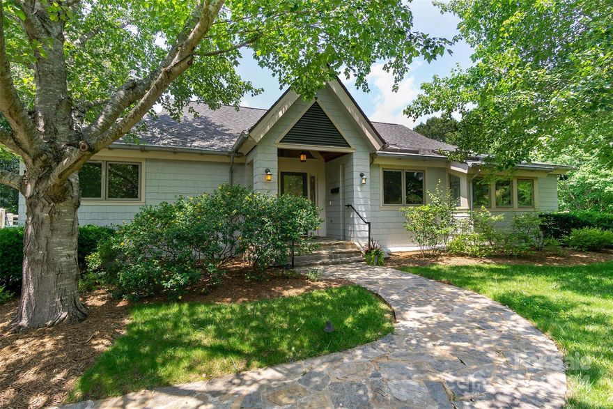 Back on the market - Buyers got cold feet! Amazing custom build with seasonal mountain views of Pisgah National Forest only fifteen minutes from downtown Asheville now available in the much sought after neighborhood of Eastmoor! No detail was too small for this custom home built by a local award winning builder. Main level wood floors just refinished. Local artisan features include custom chandeliers in entry foyer and dining area, custom stained glass windows in primary bathroom, one of a kind painted backsplash in kitchen, one of a kind floor mosaic downstairs, both painted by AVL artist Sharon Tompkins. Solid cherry cabinetry and molding, solid oak stairs and banister, imported Swedish sauna on lower level and cedar lined closets, even down to porcelain doorknobs on some doors. Other unique features include hidden safe room, home generator, radiant floor heating and wired stereo speakers. New dishwasher and refrigerator just installed.