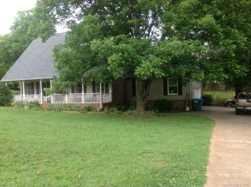 1.5 story, 3 BR, 2.5 BA home w/rocking chair front porch & fenced back yard. Enjoy the Ht/cooled Sunroom w/tile flrs, Spacious Master BR on main, Master BA w/his/her vanity, garden tub & sep. shower. Great Rm w/masonry FP, Kitchen w/Gas range, lots of cabinets & spacious Breakfast Rm.  Upstairs bedrooms have lg walk-in storage plus walk-in closets. Your buyers will love the convenience to I-85(less than 5 mins).  Storage Galore! Over sized garage w/pull down attic stairs. Large fenced bck yd.