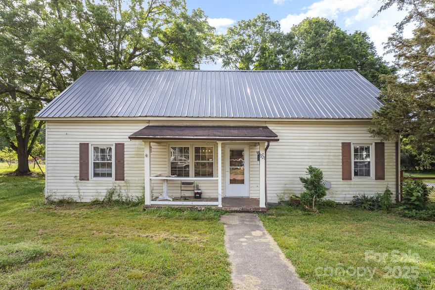 2 parcels! The vacant lot [approx 0.3 acres] that's adjacent to home will also convey! Parcel number 20682. This is a Perfect investor opportunity, offering 2 bedrooms and 1 bathroom in Shelby, located just minutes from US-74. Massive 12x26 building will also convey and is perfect for a shop, storage, etc...Metal roof was installed approx 3-4 years ago, gas pack replaced in 2017, water heater replaced in 2023. Real hardwoods in living room and a bedroom. The home also features a 3rd room with a walk out porch, and this space could be used as a bedroom or an office, although there isn't a closet. Professional photos will be uploaded soon. Stove in kitchen and security cameras will not convey.