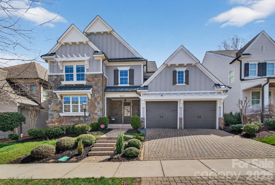 Nestled in the highly desirable Providence Retreat community of South Charlotte, this exquisite custom home built by Classica offers timeless architecture, exceptional craftsmanship, and a thoughtfully designed layout ideal for modern and multi-generational living. Ideally positioned near several of Charlotte’s premier private schools, including Charlotte Latin School, just a short 4-minute drive away, the location offers exceptional convenience for families seeking top-tier educational opportunities. Beautiful hickory hardwood floors welcome you upon entry, leading into an elegant main level featuring a private office, formal dining room, and a spacious living area filled with natural light. The open-concept design seamlessly connects the living room to the gourmet kitchen and screened outdoor porch, creating the perfect flow for everyday living and entertaining. The chef’s kitchen is a true centerpiece, showcasing stainless steel appliances, a gas cooktop with range hood, granite countertops, abundant cabinetry, designer backsplash, and an oversized island with bar seating and generous prep space. The luxurious owner’s suite on the main level features a tray ceiling, a spa-inspired bath with a large glass walk-in shower, an expansive walk-in closet, and direct access to the laundry room with double hookups for ultimate convenience. Upstairs, you’ll find a cozy loft with custom built-ins, along with two bedrooms featuring private en-suite baths and two additional bedrooms connected by a shared bathroom — offering flexibility for guests, hobbies, or growing households. Throughout the home, elegant crown molding, wainscoting details, designer lighting, and abundant storage elevate both style and functionality. Step outside to enjoy the private fenced backyard with mature privacy trees and an extra-large deck, perfect for entertaining family and friends. Additional highlights include a cobblestone driveway, covered stone and brick front porch, manicured landscaping, and a two-car garage. Located just minutes from Uptown Charlotte, I-485, and South End, this home combines luxury living with everyday convenience in one of South Charlotte’s most established and sought-after neighborhoods. A must-see home that truly has it all.