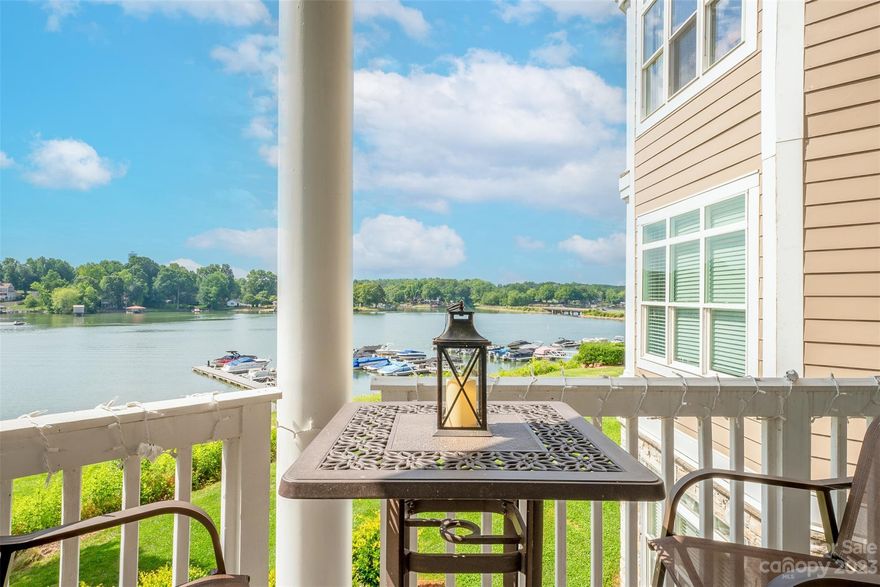 Welcome to the RARE waterfront, END UNIT home in the desirable Harbor Point Village community. Enjoy the year-round views of Lake Norman on your balcony with the privacy of trees. The additional windows offered with an end unit allow for an abundance of natural light, creating an airy and bright atmosphere. The open concept layout offers large bedrooms, LVP flooring, built-in's, double sided fireplace and gorgeous finishes.  Spend time entertaining in the timeless kitchen with stainless steel appliances, granite counters and breakfast bar. Enjoy this charming lake home for yourself OR as a profitable vacation rental. Located by the popular Lake Norman waterfront restaurants, Eddie's on the Lake and Havana 33. The Harbor Point Village community features a pool, kayak/canoe/paddle board storage racks, and it's also one of the rare condo communities around the lake offering elevators. Currently operating as a furnished, turnkey vacation rental!