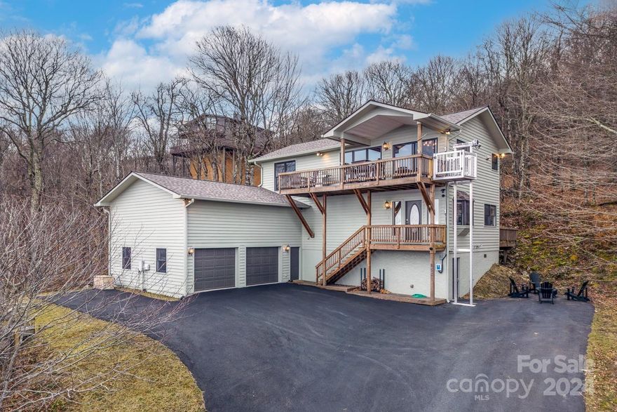 Immersed in the most breathtaking views of the high country, this remarkable retreat invites you to live an enviable mountain lifestyle. Elegant features are evident throughout, from the stunning tongue-and-groove ceiling to the gorgeous granite counters. Savor the sunset views from the covered deck, overlooking an expansive view of four states. A new roof in 2023 and a generator ensure piece of mind. Located close to it all- Skiing, tubing, brewery, restaurants, golf, pool, tennis, trails, lakes and the Beech Mtn rec center. Beech Mountain presents opportunities for residents and renters in all four seasons- winter sports, lush spring, cool summers and a stunning leaf season. The Beech Mountain Club is current and transferable. Home is sold fully furnished with everything you need to start enjoying life in the High Country. 2023 upgrades including roof, freight lift, view opened up significantly, new furniture, upfitted rec. room, gutter guards, large capacity washer/dryer and paint.