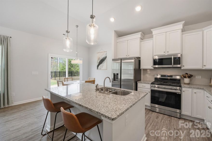 $4,000 PRICE IMPROVEMENT! Welcome to this beautifully built 2023 ranch home in Sherrills Ford! The perks of new construction and full smart home without the wait! This thoughtfully designed 1 story home features a desirable split floorplan with 3 bedrooms and 2 full baths. The living area is an open-concept layout ideal for your entertainer's heart and great flow. The kitchen features a gas range, granite countertops, and lots of cabinet space, all flowing seamlessly into the main living area. There is also a dedicated laundry room with storage & 2 car garage. Tankless water heater because everyone loves instant hot water! Enjoy outdoor living in the flat backyard that backs to woods, providing a peaceful, private setting. The yard is partially fenced, making it easy for the next owner to complete if desired. The Villas of Sherrills Ford offers great amenities, a neighborhood pool perfect for summer and lawn care included with HOA dues to save you time. This home combines low-maintenance living with great amenities. Conveniently located off Hwy 150, you’ll have quick access to Mooresville, shopping, dining, and all that beautiful Lake Norman living has to offer. Easy access to HWY 16 for those that need to travel to Denver, Lincolnton, or West Charlotte. There is a transferable 10-year structural warranty, with approximately 7 years remaining. CPI security system conveys and so do all appliances with an acceptable offer. Don't miss out on this beautiful home and community! All types of financing available Conventional, FHA, VA, & USDA!