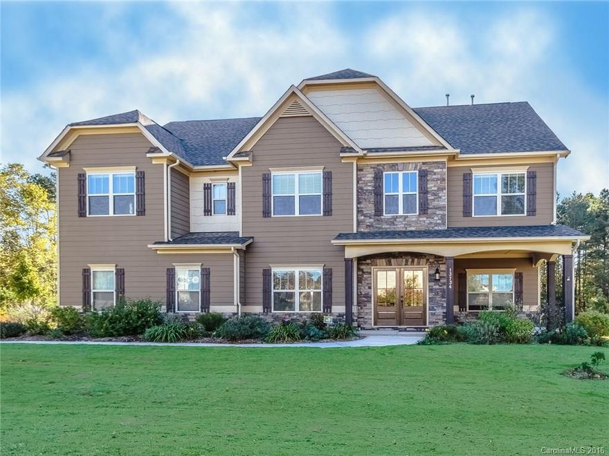 Stunning home w/ main-level guest suite, 2-story great room w/ stone fireplace. 3rd floor retreat w/ huge bonus room, kitchenette & bedroom/bath. Kitchen w/ stainless wall ovens & gas cooktop. Hardwoods in 1st floor living areas. Impressive master suite w/ sitting area, garden tub, separate shower, & double walk-in closets. Enjoy outdoor living on the covered front porch or the patio overlooking the yard w/ wooded area behind. Short commute to Uptown Charlotte!