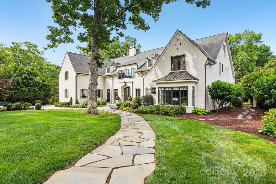 A true Foxcroft estate with timeless luxury and grand-scale living. This newly updated 8,974 sq ft home offers 6 spacious bedrooms, 5 full and 2 half bathrooms, and has been thoughtfully renovated throughout—enhancing bedrooms, bathrooms, and main living areas with fresh, designer finishes. Set on a beautifully landscaped .60 acre lot, the home features a painted brick exterior, XL 3-car garage, and handcrafted details including custom millwork, TruStile doors, and refined lighting. The main-level primary suite is a private retreat with a sitting vestibule, coffee bar, spa-style bath, and room-sized closet. Flexible living spaces include a formal study, guest suite, media room, fitness/sauna space, bonus room, and craft/laundry room. Outside, enjoy a covered terrace, outdoor kitchen, limestone pool deck, and lush backyard with maintenance-free turf—perfect for pets and play. Ideally located minutes from SouthPark Mall, fine dining, top schools, and more.