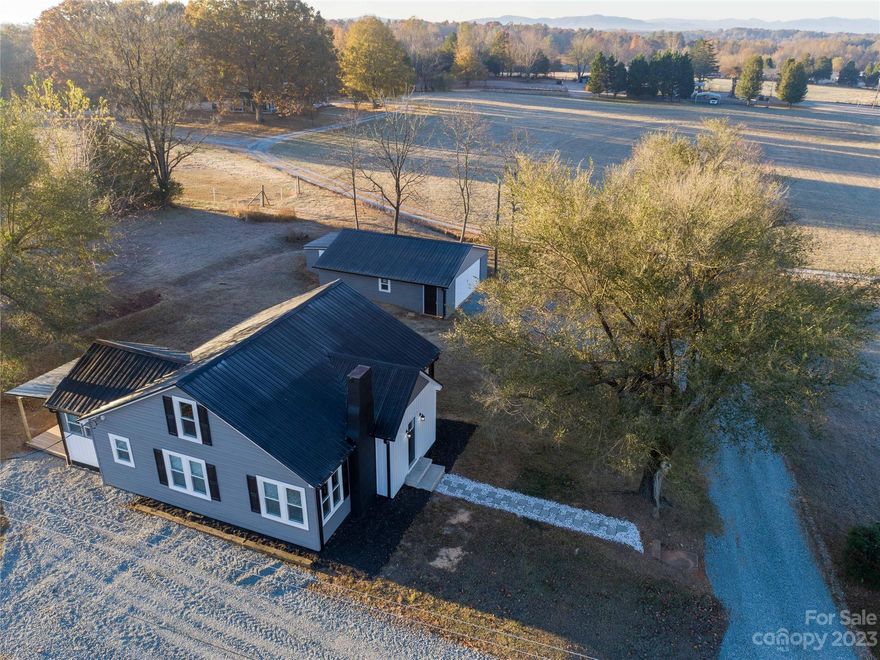 NEWLY RENOVATED FARM HOUSE STYLE HOME ON 1 +/- ACRE! Updates include new metal roof, gutters, vinyl siding & window replacements, new heat pump & electrical upgrades...enhancing both aesthetics & durability. Inside, the flooring has been meticulously upgraded with plush carpeting & modern laminate "wood" floors. The entire interior has been painted, creating a bright & inviting atmosphere. The kitchen has undergone a stunning makeover boasting elegant granite counter tops--providing space for culinary adventures--& new cabinets, fixtures & appliances! The bathroom has also been transformed. There are 2 bedrooms on the main level--upstairs is a completely finished flex room not counted in hsf because of the roof pitch. An additional flex room off back of home for den, etc. With its thoughtful updates & modern amenities, this "farmhouse" offers both charm & functionality for a delightful living experience. There is a detached garage for parking vehicles & storage room built on the back.