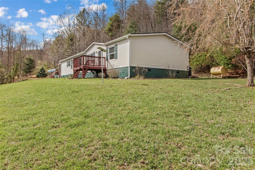 Tucked away on 2.47 private acres with no restrictions, this well-maintained and thoughtfully updated home offers the perfect blend of comfort, space, and peaceful country living. Featuring 2 bedrooms, 2 full bathrooms, plus a bonus room ideal for a home office, hobby space, or guest room, this property provides flexibility to fit your needs.

Inside, you’ll love having both a living room and a separate family room, complete with a cozy gas fireplace for relaxing evenings. The spacious kitchen offers plenty of room for cooking and gathering, with access to a walk-out covered porch—perfect for morning coffee or entertaining.

Step outside and enjoy nature at its best with a firepit area for evenings under the stars. A rain barrel collection system is in place to help keep your flowers and garden thriving. A carport provides convenient covered parking, and an additional storage building offers extra space for tools, equipment, or outdoor gear.

Surrounded by privacy and natural beauty, enjoy the freedom of unrestricted land while having a home that’s move-in ready and full of charm!