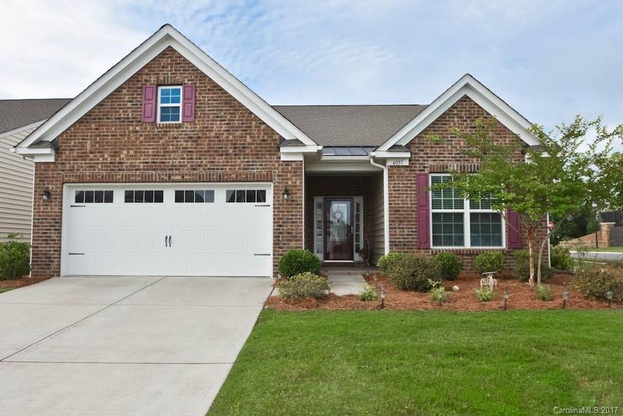 Beautiful brick front Cambridge model sitting on a spacious corner lot. Front porch flows into a welcoming entrance. Hardwoods throughout main, crown molding and wainscoting accents, many recessed can lights throughout. Kitchen opens up into the great room and breakfast area. Spacious master bedroom, large master bath with walk in shower, and large walk in closet. 2nd bdrm with own full bath. Upstairs offers a 3rd bdrm with full bath and bonus room. Extensive landscaping all around!