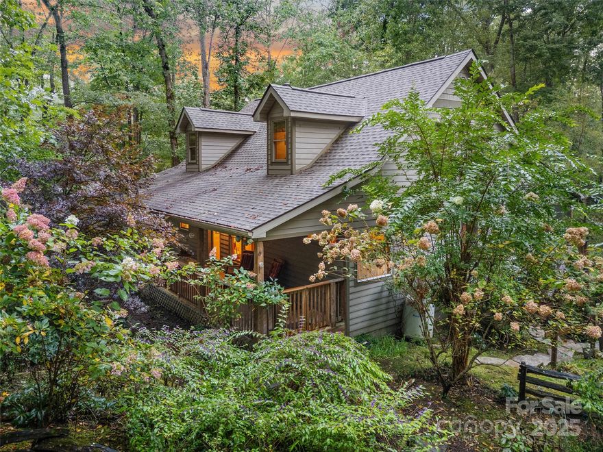 Discover a home where rustic mountain charm meets modern luxury at 779 Thissa Way in Brevard, NC. Nestled in the heart of the East Fork River Valley, this extensively renovated 2BR/2BA home offers a one-of-a-kind connection to nature in a peaceful setting, just minutes from downtown Brevard’s shops, dining, and vibrant arts scene. Step inside to find a bright, open layout designed for single-level living. Vaulted ceilings, large windows, and thoughtful craftsmanship fill the living spaces with light and warmth. The renovations highlight every detail—from the upgraded kitchen and bathrooms to carefully chosen finishes that balance contemporary style with timeless mountain character. The primary suite provides a private retreat, while the guest bedroom and bath offer comfort for friends and family. Outdoor living spaces allow you to relax and listen to the sounds of nature, surrounded by the valley’s beauty. With Pisgah National Forest, DuPont State Forest, and Gorges State Park just minutes away, you’ll enjoy world-class hiking, cycling, and waterfalls at your doorstep. If you’ve been searching for a mountain home that combines natural beauty, modern updates, and proximity to both wilderness and town, 779 Thissa Way delivers the perfect blend.