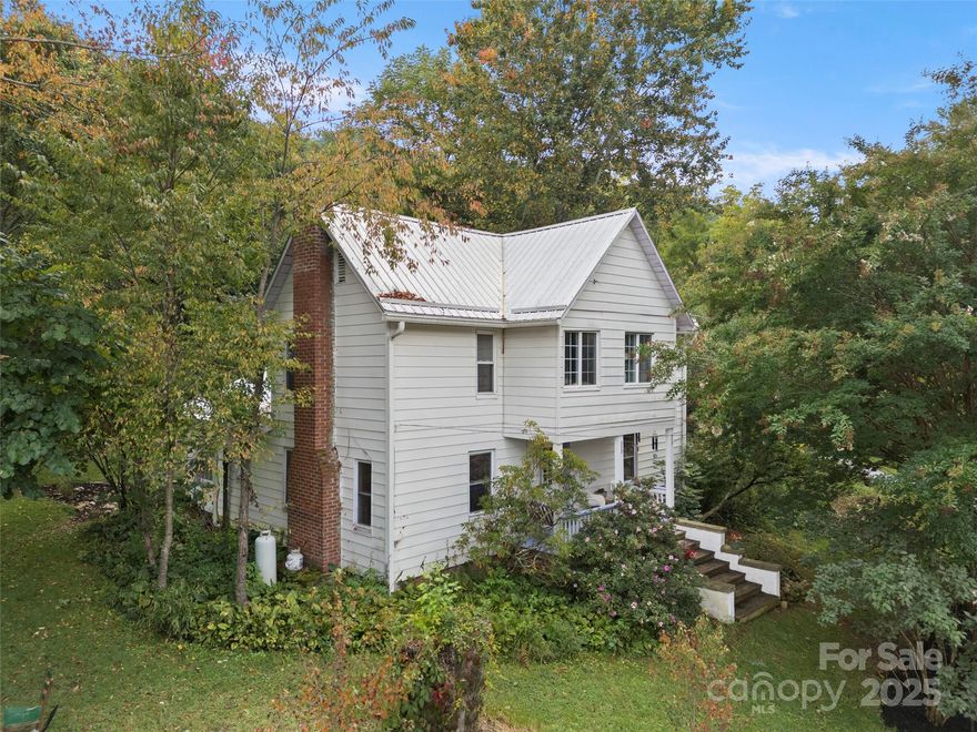 Nestled in the desirable countryside of Kims Cove, this charming 1920s two-story farmhouse invites you to embrace a simpler, more intentional way of living. With bead board ceilings, original wood floors, and a sense of history woven into every detail, this home balances timeless character with thoughtful updates. The renovated galley kitchen blends old and new with butcher block countertops, stainless steel appliances, and fresh cabinetry. Gather in the dining room that flows into the cozy living room, where a wood stove and built-in bookshelves create the perfect backdrop for quiet evenings or lively conversation. A main-level bedroom provides easy accessibility, while upstairs you’ll find two spacious bedrooms and a sunroom retreat filled with natural light. Ample storage is available in the walk-in attic and efficient mudroom with laundry hookup. Period details shine in the black-and-white tiled bath featuring a salvaged corner sink, while modern updates—such as a metal roof (less than 10 years old), July 2025 heat pump, many vinyl replacement windows, updated electric, septic tail lines, a five-year-old well pump, and an 80-gallon water heater—bring peace of mind. The property is a homesteader’s dream: a root cellar for storing canned goods, a double-dug garden ready for your harvest, and a chicken coop with fenced lot. Native plants and natural landscaping create a serene backdrop for yard games, al fresco meals, or storytelling around the fire pit. If you’re looking for a home that offers both history and self-sufficient living, this Kims Cove farmhouse delivers it all. Pre-Inspected!