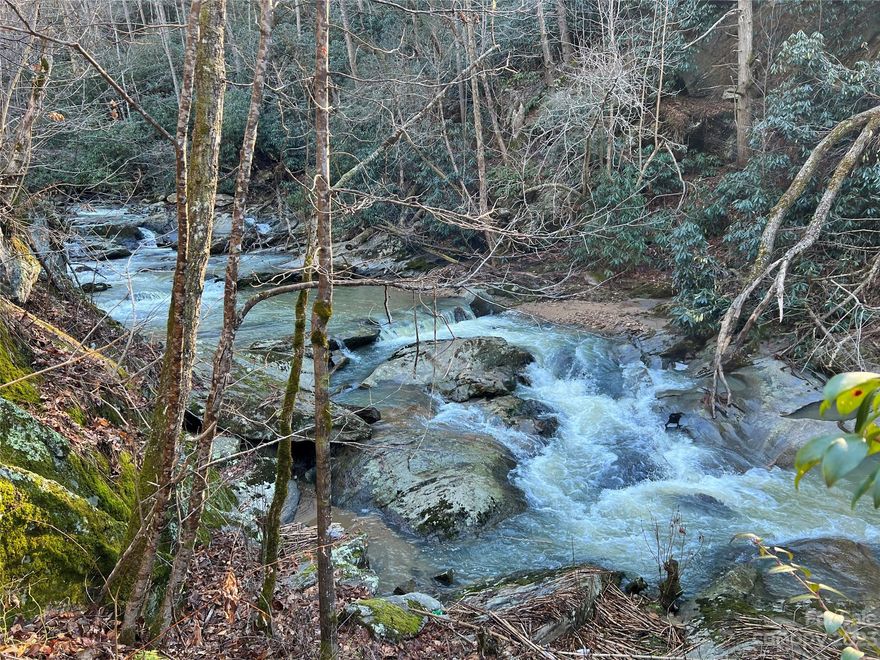 A very unique property offering! 22 acres with spectacular whitewater creek! Meadows, scenic mountain views, great home sites, privacy and just 10 minutes from the vibrant town Marshall! Easy access to Asheville. This property has everything to offer! Long frontage on beautiful Walnut Creek just before it flows into the French Broad River. Near river access for whitewater sports. Southern exposure.  Paved access, power, and fast fiber internet! Convenient location. A special property to create your dream place here in the mountains!