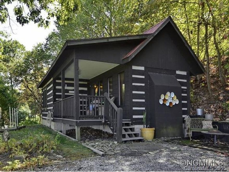 The perfect cabin with SPECTACULAR VIEWS! You can see downtown and GPI! Home is true cabin construction with exposed post and beam - absolutely feels like you are in a dream! Wood Stove and views from your bed are bonuses. The front porch is what people dream of. Please note* Home has 1984 single-wide on property, which is rented- no value/no representation.