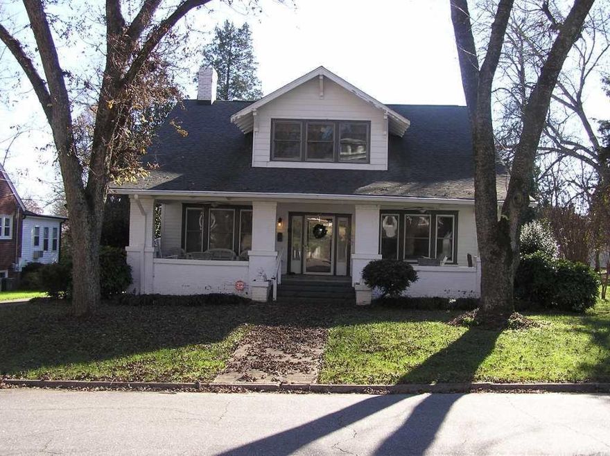 This Beautiful 4 Bedroom/2 Bath Custom Built Home is located in Historic Newton. Built in 1921, this home features a lot of original amenities such 10-foot ceilings, beautiful 10-inch oak baseboards and crown moldings, circa 1920 wooden doors along with original door knobs, and beautiful oak hardwoods. Also featured is a beautiful formal living room, a quarter-landing stairwell with ornate columns and railings, a cozy drawing room with built-in bookshelves and a gas fireplace, a spacious formal dining room, a quaint breakfast nook with built-in church pew style seating surrounding an attached table, and a very large kitchen with spacious cabinets. The quaint master bath has a large circa 1920's bathtub, and a glass-enclosed back porch with washer/dryer hook-up. The house has the original wooden floors. The upstairs bath features a sitting area highlighted by a jetted tub surrounded by beautiful tile. The exterior features a cozy front porch and a 12' X 12' deck in rear.