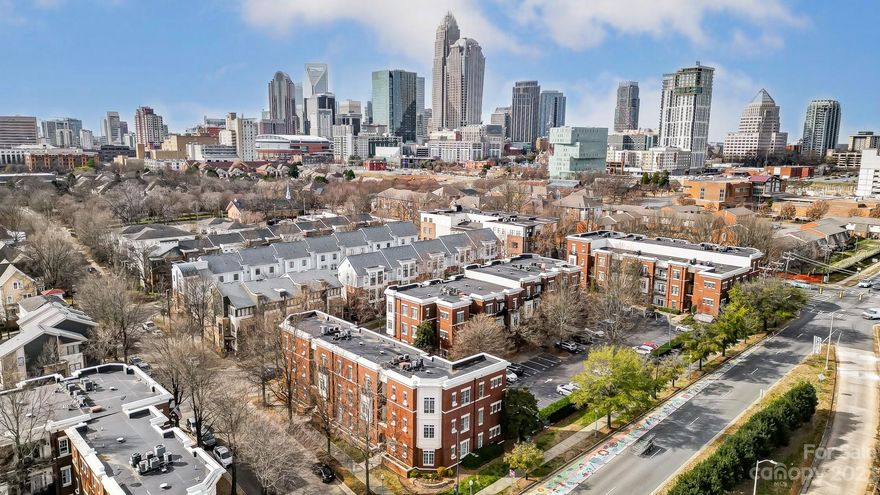 Neighborhood charm in Charlotte's First Ward Garden District! This pristine 2 bed, 2 bath condo sits in a prime location just minutes from all uptown Charlotte has to offer. High ceilings and desirable LVP flooring welcome you home with main level entry. The living room flows seamlessly into the kitchen, maximizing the living space. The kitchen boasts stainless steel appliances, a tile backsplash, and a spacious island with room for seating. The primary suite features two closets and an ensuite bath with granite countertops and tile flooring. A generous secondary bedroom is ideal for guests or a home office with access to a full hall bath, also with tile flooring and granite countertops. Full-size stackable washer and dryer conveys. Walk to many of the Queen City's famous bars, restaurants, theaters, shops and more!  Just a short walk to the Little Sugar Creek Greenway!