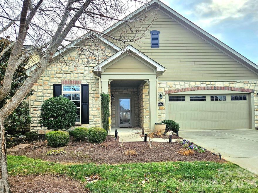 Welcome home to this beautiful patio-style 2BR/2BA home with a bonus room, one of a limited number of homes in the community to feature both a private courtyard AND a screened porch. Located in the gated 55+ community of Polo Gate at Mountain Island Lake, the Portico floor plan is one of the community’s most sought-after designs and provides effortless one-level living with no stairs.

The light-filled, open layout features a well-appointed kitchen with stainless steel appliances, double ovens, granite countertops, and beautiful cabinetry. The bonus room offers flexible space ideal for a home office, sitting room, or personal retreat. Thoughtful upgrades include tray ceilings, hardwood floors, a gas fireplace, walk-in closets, and a zero-entry shower.

The spacious two-car garage adds everyday convenience. Additional outdoor storage is conveniently located off the private courtyard, ideal for tools or seasonal items.

Polo Gate offers a low-maintenance lifestyle in a peaceful, tucked-away setting that feels private and serene, yet remains close to shopping, dining, medical facilities, Mountain Island Lake, Lake Norman, Denver, Huntersville, I-485, and Charlotte Douglas International Airport.  Community amenities include a charming clubhouse with a fireplace lounge, fitness room, sidewalks, and a beautiful outdoor pool.