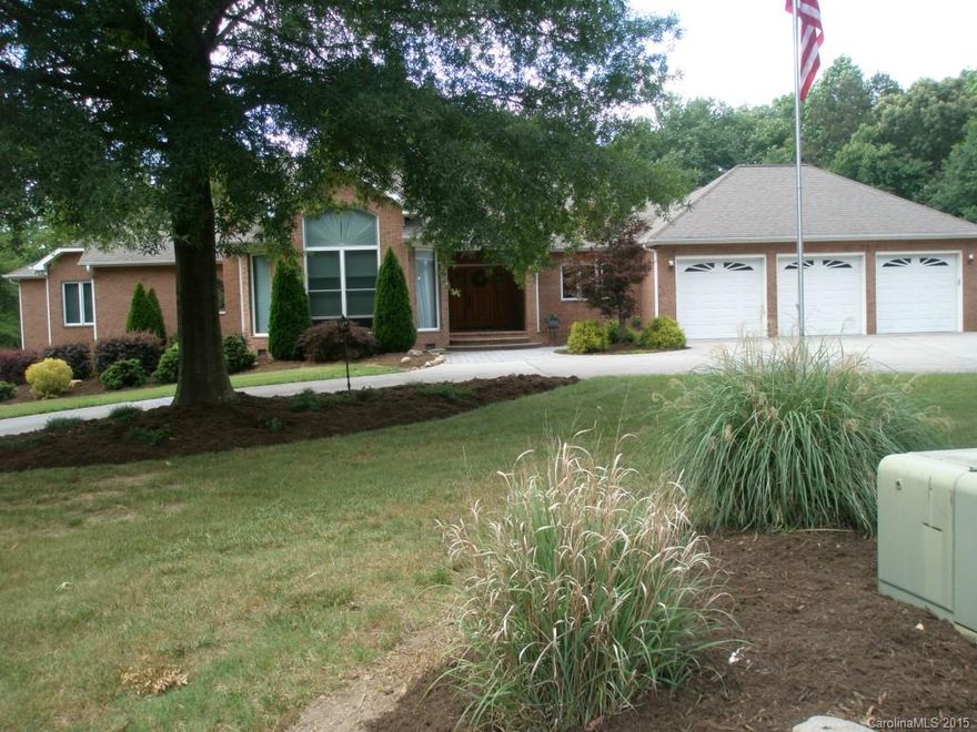 Southern living at its finest. Located in quiet, upscale, established neighborhood on 6 wooded acres. All brick, 4 bedrooms, 3 full recently updated and two 1/2 baths , 3 car extra deep attached garage with openers. 2 gas fireplaces, one in 20' x 18' formal living room and stone fireplace in 24' x 17' family room. Corian counter tops in kitchen. Stainless steel gas cook top and oven. SS refrigerator & dishwasher. Marble counter tops and built-ins throughout. 2 wet bars. Dining room 15' x 12'.