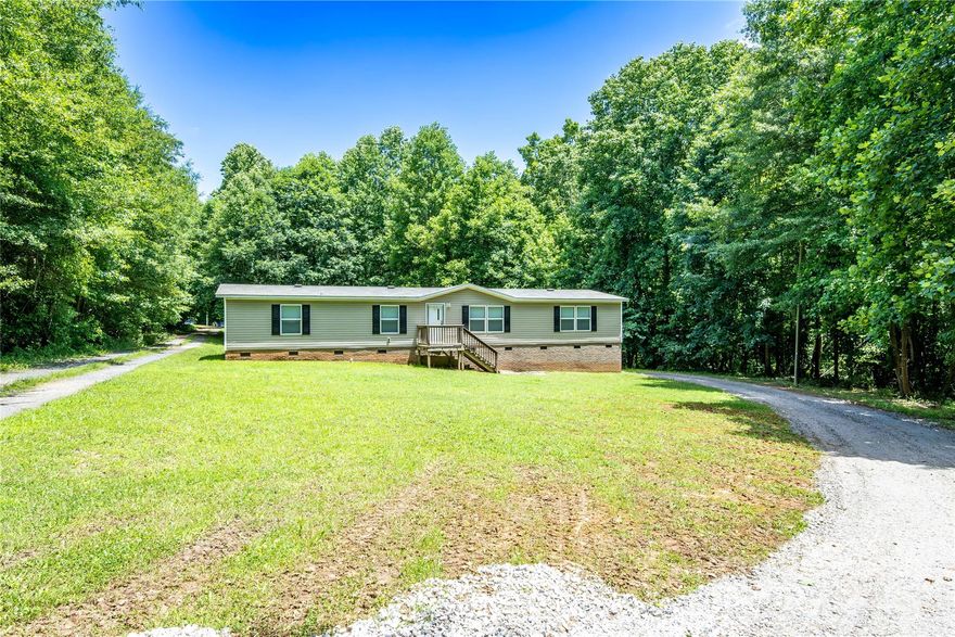 Welcome to 812 Acclaim Drive, located in the peaceful Davidson Ridge Subdivision! This spacious three-bedroom, two-bathroom home offers approximately 1,824 heated square feet of comfortable living space and sits on a generous 1.91-acre lot, providing privacy and a serene natural setting surrounded by mature trees.
The thoughtfully designed split-bedroom floor plan features a large living area and a well-appointed kitchen with a center island -perfect for everyday living or entertaining. The primary suite includes a walk-in closet and a spacious bathroom with a relaxing soaking tub. Additional highlights include a brick foundation, walk-in closets in multiple bedrooms, and the freedom of no HOA. Enjoy the space and seclusion this property offers while still being conveniently located near the amenities of York.