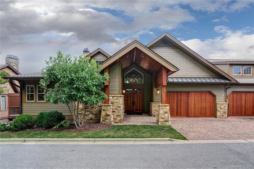 Looking for that spectacular, high end, lock-n-go opportunity w/expansive mtn views & min. to Fresh Market, AVL Country Club, d'town & more...then look no further! This stunning townhome is located within Reynolds Mountain & has been meticulously cared for. Features grand vaulted T&G ceilings, open floorplan, high end kitchen w/Viking appliances, 2 car garage, master BR on main- 2 bedrooms, over-sized bonus room & family room on lower level & 2 expansive covered decks on both levels.