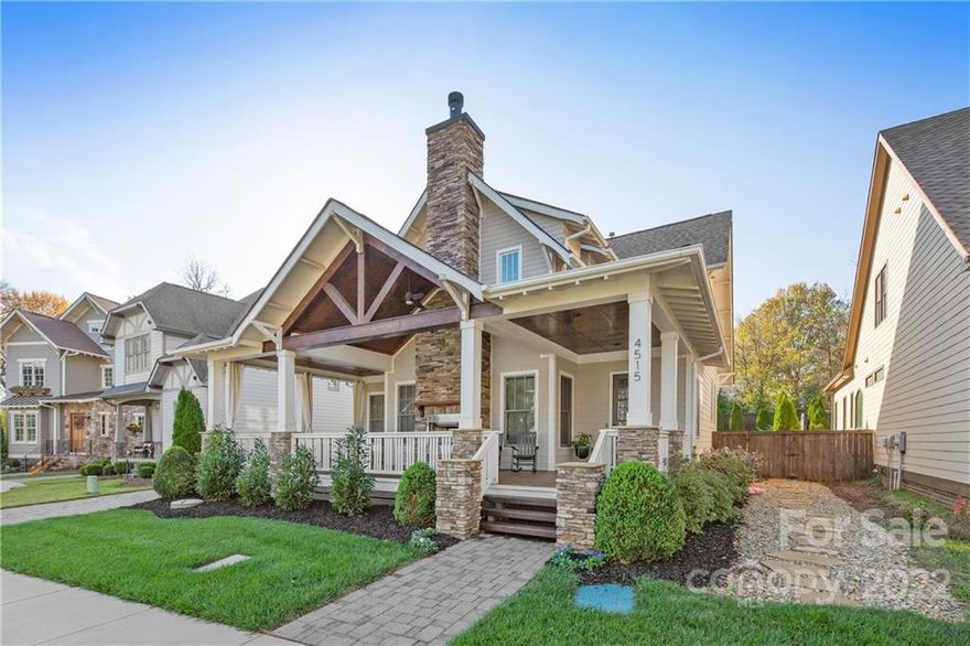 One of a kind Craftsman built by Grandfather Homes, features a gorgeous open main level living room with stone fireplace and 10' coffered ceilings. Hardwood floors throughout, custom kitchen with luxury appliances. Upon entering the home, you will be welcomed with a large inviting front porch along with an outdoor stone fireplace, a great space for entertaining. Backyard features a custom pool with a waterfall and a spacious cascading spa. Primary bedroom has two walk in closets, bathroom with dual vanities & custom shower.  Plenty of natural light and freshly painted throughout. 2nd living quarters over the garage is perfect for guest suite, bedroom or rental, features a walk in closet, full bathroom with steam shower, kitchenette and queen size murphy bed. 2 car garage with large storage unit. Automatic gate to garage/pool and rear yard for added security. Located in one of the most desirable areas of Charlotte, less than a mile from Freedom Park.