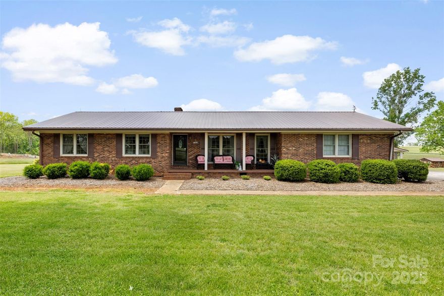 Discover this beautiful and unique property set on 8 beautiful acres. Offering plenty of room to roam, this home is ideal for those seeking peace, privacy, and endless possibilities. The main house is approved for a 2-bedroom septic system and currently features 2 spacious bedrooms and 2 full baths. An additional versatile room can serve as a third bedroom, home office, or study. The home has been lovingly maintained to preserve its original character and charm, offering a warm and inviting atmosphere. A detached 2-car garage and a 2-car carport provides ample space for vehicles, storage, or a workshop area. The property includes a charming barn-style guest house with its own septic system. This guest home features a kitchen, living room, an upstairs bedroom, and a full bath. All roofs have been replaced to metal roofs. Septic tanks have been pumped within the year. HVAC is fairly new and a sub-pump has been added to the crawlspace.