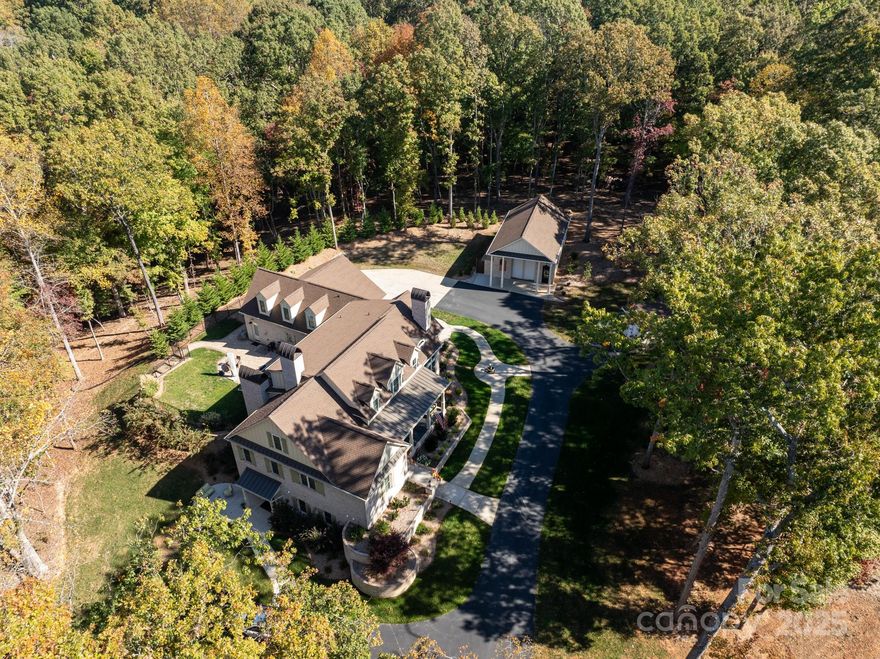 Custom home w/ attached 3car garage & detached 3 car garage (both climate controlled)situated on 5 acres.High end finishes, including 7" french white oak floors,slate tile on all porches w/ reclaimed wood ceilings, double mahogany front doors, roll out cabinetry drawers, designer lighting & control 4 automation.Open kitchen featuring a 10 foot island w/ walnut cabinets & solid granite top.An amazing appliance package including a gas Aga Elise range w/ double ovens, 5 gas burners & slide out broil oven.Great Room features a gas fireplace, coffered ceiling & opens to an amazing covered screened porch featuring a wood burning fireplace.Primary on main w/luxury bath w/ vessel tub, deluxe designer shower & custom closet.Upstairs features 3 secondary rooms, 3 full baths a large bonus room plus walk in storage.Basement w/ separate entrance features secondary living quarters featuring a kitchenette. Outside includes a 900+ sf detached garage with 24 foot ceilings perfect for a car lift or RV.