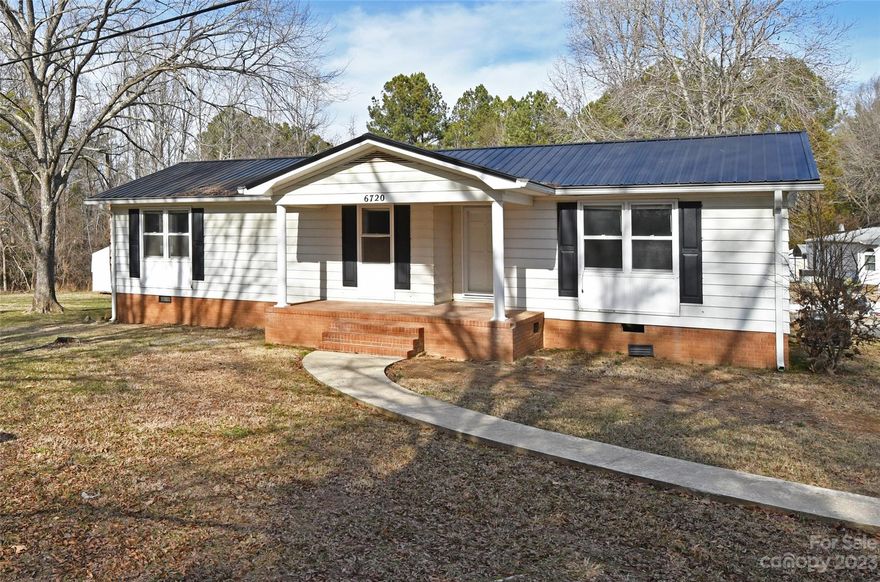 Welcome home! This recently renovated gem boasts three bedrooms and two full baths, showcasing exquisite craftsmanship and attention to detail. Step inside to discover brand-new flooring, a modern kitchen with sleek cabinets and countertops, and a freshly upgraded HVAC system ensuring year-round comfort. Enjoy the abundance of natural light streaming through new windows in the sunroom – a perfect space for relaxation or entertaining. The charming front porch invites you to unwind in a rocking chair, while the flat yard spanning approximately 3 acres offers ample space for outdoor activities. Additional perks include a tastefully remodeled bathroom and a convenient small shed for storage. This residence seamlessly blends contemporary elegance with cozy charm, creating the perfect place to call home.