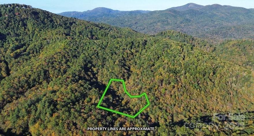 Discover the perfect setting for your custom mountain retreat on this stunning 6.36-acre parcel in the desirable Bear Track community. Just 25–30 minutes from the vibrant heart of Black Mountain, North Carolina, this property offers the ideal balance of peaceful, secluded living while a short, scenic drive leads to Lake Lure and the charming mountain towns of Bat Cave and Chimney Rock—all beloved for their outdoor recreation, dining, and small-town charm.

A gentle, year-round stream flows through the property, setting a serene and meditative tone the moment you arrive. Multiple potential build sites give you the freedom to design your ideal escape, whether it’s a cozy mountain cabin, a modern sanctuary, or a legacy property to enjoy for generations. With minimal restrictions, owners can craft a personal haven while still benefiting from a community that preserves its natural beauty. As a unique bonus, hunting is allowed on your own property, a rare feature that enhances the sense of true mountain living. Surrounded by a lush canopy of mature trees, the land offers unmatched privacy and a cool, shaded oasis in the warmer months. In winter, the landscape transforms, revealing mountain views that remind you just how special this corner of Western North Carolina is.

This is a rare opportunity to secure a substantial piece of mountain land that combines privacy, natural water features, and proximity to some of the region’s most sought-after destinations. Opportunities like this are rare, come see what makes this property so special!