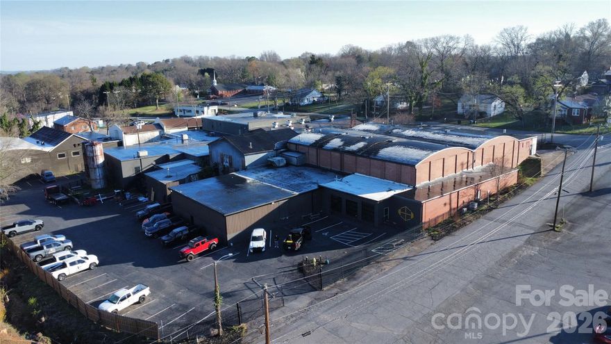 The Art Mill | 72,557 SF Industrial Warehouse on Nearly 2 Acres in Hickory, NC
Exceptional investment opportunity in the heart of Hickory, North Carolina one of the fastest-growing markets in the state. The Art Mill is a massive 72,557 square foot two-story industrial warehouse situated on 1.996 acres, offering unmatched versatility for warehouse, office, retail, flex space, or multi-tenant use. Built in 1943 and freshly renovated in 2024, this historic mill seamlessly blends original character with modern functionality.
The Building:
This heavy-duty masonry and steel construction features original hardwood floors throughout both levels, steel trusses with wood plank sheathing, and an 8-inch concrete perimeter wall foundation built to last. The first floor offers 44,660 SF and the second floor provides an additional 27,897 SF. The property includes 32,947 SF of open warehouse/storage space, 14,336 SF of flex/commercial space, and a second floor ready for additional commercial suites. The building is upfit-ready with proposed multi-tenant layouts available for 10+ suites making this an opportunity for investors or owner-users alike.
Building Features:
Loading docks with multiple dock-high doors, a BendPak HD-9 material lift (9,000 lb capacity), wet pipe sprinkler system throughout, 24-inch ventilation pipes, gated entry with chain link fencing, and 59 paved parking spaces including 1 ADA space. Public water, sewer, and streets are all in place, along with 3 on-site fire hydrants.
Structurally Certified:
Certified structurally sound by a licensed PE (March 2025), compliant with 2018 NC Building Code, with no structural deficiencies identified. Lift foundation PE-certified (April 2025). Full engineering reports are available upon request.
Current Rental Income:
Five tenants currently in place generating $4,475 per month ($53,700 annually) with significant upside potential as additional spaces are leased.
Investment Highlights:
At approximately $24 per square foot, this property offers massive value with incredible flexibility. Whether you're looking for warehouse, office, retail, or flex space or a combination of all, The Art Mill delivers. The two-story layout adds density and flexibility, multiple spaces are move-in ready, and the historic mill character creates a unique aesthetic that today's tenants and buyers are seeking.
The Location:
Hickory, NC is experiencing unprecedented growth, attracting new residents, businesses, and investors from across the region. Situated in Catawba County with easy access to major highways, The Art Mill offers the perfect combination of visibility, accessibility, and opportunity. This is your chance to invest in a property with proven income and massive upside in one of North Carolina's most dynamic markets.
The honest takeaway: At $1,760,000 with only $53,700 in annual gross rent, the current cap rate is roughly 3% - below the 6–8% typical for industrial in this market. The property is significantly underrented. 5 tenants generating $4,475/month on 72,557 SF is essentially nothing.

The upside story (where the real value pitch is): If you stabilize the building at even modest market rents - say $4–5/SF NNN on 60% occupancy - you're looking at $170,000–$215,000 in gross income, which at a 40% expense ratio produces an NOI of $102K–$130K and a stabilized cap rate of 5.8–7.4% on the ask. That's the investment thesis - you're buying the asset at its physical value with upside from lease-up, not buying a stabilized income stream
This opportunity will not last. Schedule your private tour today!