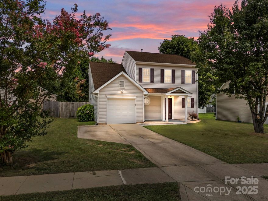 Charming single-family home featuring a clean, neutral interior and a 1-car garage—move-in ready and thoughtfully maintained. The living area centers around a cozy fireplace, while the kitchen with adjacent dining space overlooks a private backyard and oversized paver patio—perfect for outdoor entertaining or quiet mornings. Upstairs, the vaulted-ceiling primary suite includes a private bath and walk-in closet, accompanied by two additional bedrooms and a full bath. Convenient location to Mountain Island Lake, I-485, and I-77. Easy access to airport, shopping, and dining.