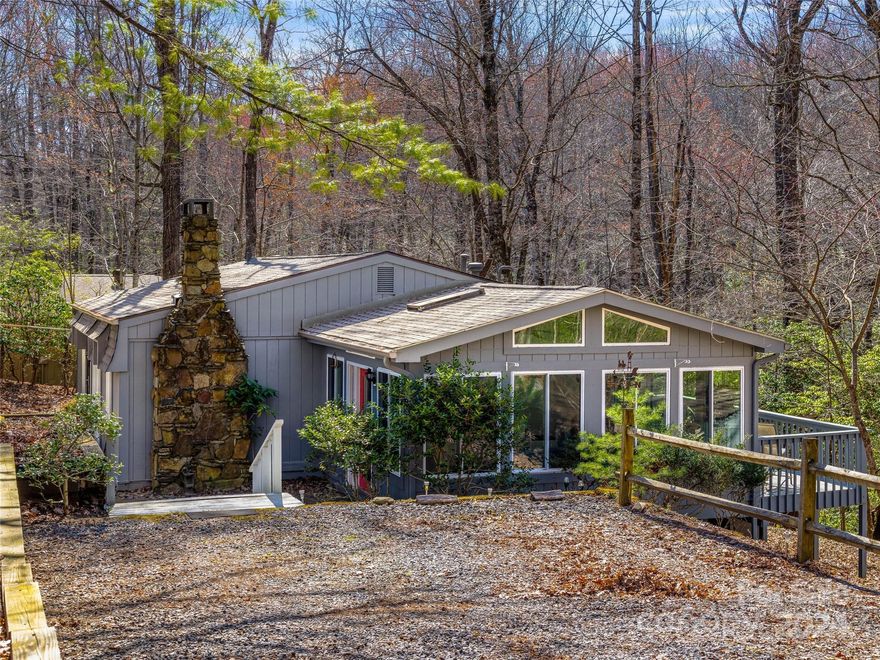 Tucked in a cove with close proximity and views to Lake Ticoa, this charming Connestee Falls home invites you for the Summer season or for full time residence.  This 1972 European inspired cottage is full of character and personality, and is positioned on just over a half acre for peace and privacy.  Hand stacked stone chimney, new roof and the light filled sunroom are a few of the property features. 462 S. Sequoyah has been a peaceful gardening haven for its current owner, and is now ready for its next chapter.  Come take a tour of this special property and discover all the amenities of the ever popular Connestee Falls mountain community in Brevard, North Carolina. First-time resident pays a one-time amenity fee of $13,000 at closing, or $15,000 if paid by end of the calendar year. *There is a pending lawsuit between several homeowners and CFPOA regarding interpretations of restrictive covenants of short-term rentals.