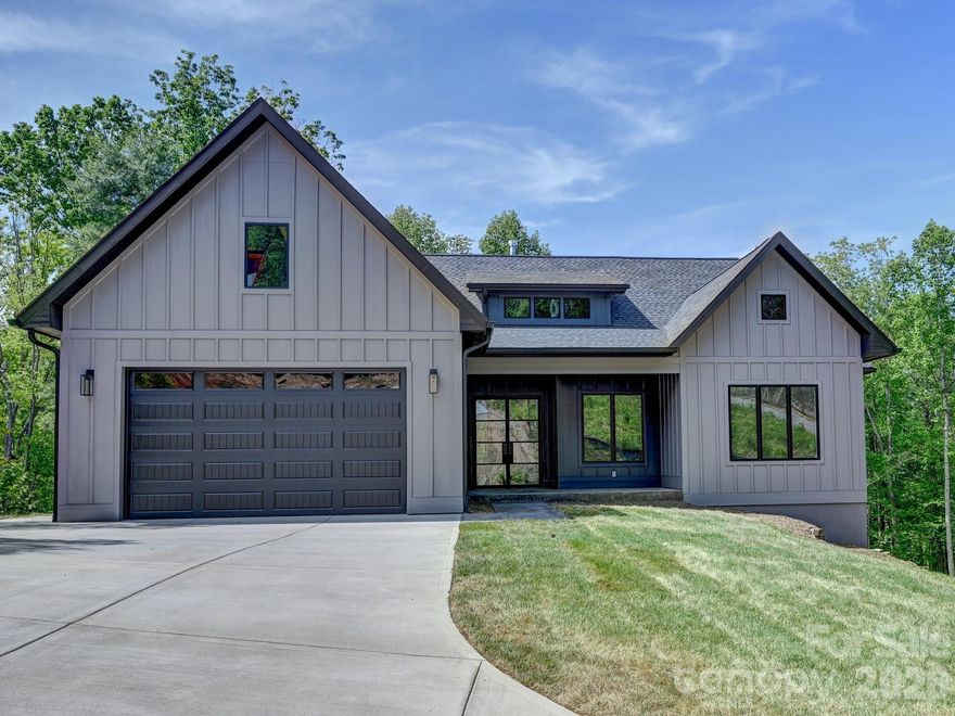 Experience the pinnacle of modern mountain living with this exceptional new construction home in the prestigious Crossings At Cane Creek. Located in charming Fairview, NC, this high-quality residence seamlessly blends luxury with functional design, featuring a spacious 2-car garage and stunning mountain views that serve as your daily backdrop. Inside, the living space is anchored by an elegant gas fireplace, while the primary suite offers a private sanctuary with a deep walk-in closet and a laundry room conveniently connected to the primary bath. Modern efficiency is prioritized with a tankless water heater for endless comfort. Downstairs, the massive unfinished basement presents a world of opportunity—a blank canvas ready to be transformed into additional square footage, a dedicated workshop, or expansive storage. Whether you are admiring the peaks from your window or planning your dream expansion, this home offers the perfect foundation for your North Carolina lifestyle.