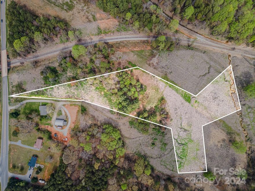 6.12 Acres - Rare Opportunity - INDUSTRIAL zoned land in Sherrill's Ford. Land is adjacent to rail road tracks on North side and to the East adjoins Duke Energy / Marshall Steam Plant. Conveniently located - 30 miles to Uptown Charlotte, 32 miles to CLT Int'l Airport, 6 miles to Denver, 10 miles to Mooresville. Owner to transfer to LLC prior to closing. Please do NOT walk property without prior authorization - Contact co-agent for any questions. Industrial provides for intensive manufacturing, processing and assembly uses per county website.