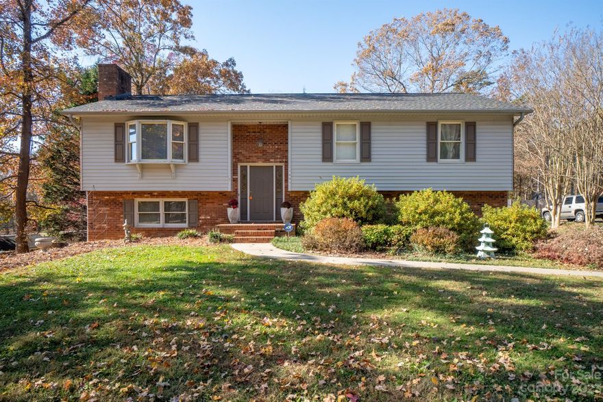 Welcome home to this well maintained custom built home. The home sits on a private lot with fully fenced backyard. Once inside this home offers tons of natural light, new LVP floors upstairs throughout the living space, bedrooms & baths 2021. The living room boasts a wood burning fireplace & picture window with new blinds November 2023. Kitchen complete with lots of counter space and cabinets, new dishwasher 2022 leads to the backyard covered screened in deck perfect for entertaining. The primary bedroom is generous in size offers an en-suite. The two secondary bedrooms are also located on the main level with an additional full bath. Downstairs you'll find a bonus room, full bath with a walk-in closet for extra storage. The oversized laundry/mud provides a great please to have a home gym or more storage & has a door to the backyard patio. The side-load 2 car garage is oversized & finished with more storage room and a door leading to backyard. Lots of Newness see attached upgrade list.