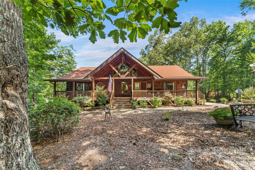 Welcome to 279 Outback Trail in Nebo NC with plenty of room to roam! Located in The Meadows and Lake James Station, this extraordinary 3BR/2BA home sits on 9.5 acres across 3 lots and offers stunning mountain views. The main level features a large open great room filled with natural light, plus covered front and back porches perfect for enjoying the serene setting. A large primary bedroom suite on the main level with large full bath and walk-in closets.  An oversized garage for two cars and plenty of storage space. The full finished basement provides ample additional living space, ideal for guests, recreation, or home office use. Enjoy a community pool, and the convenient location just minutes from Lake James and I-40. A rare find with privacy, views, and community perks!