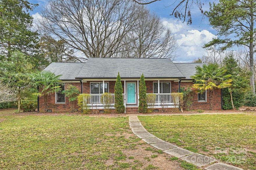 ****Motivated seller! Bring all offers!"****

This charming 3bdrm 2bath ranch-style home offers a perfect blend of comfort and country living. Nestled in a serene, peaceful setting, it features a spacious, open concept living area. The cozy living room is ideal for relaxing, while the adjoining dining area is perfect for family meals or entertaining guests.
The kitchen is both functional and stylish, with modern appliances, and an island. The primary suite includes an en-suite bathroom with a walk-in shower and ample closet space. The two additional bedrooms share a full bathroom. The carport has been enclosed to make for a nice office or bonus room
Outside, the property has plenty of space for gardening, outdoor activities, and more. The home also features a covered front porch and back porch, perfect for enjoying the fresh country air.
Home is less than 1 mile to HWY 74 bypass. *Partition walls & mini split in carport where not permitted