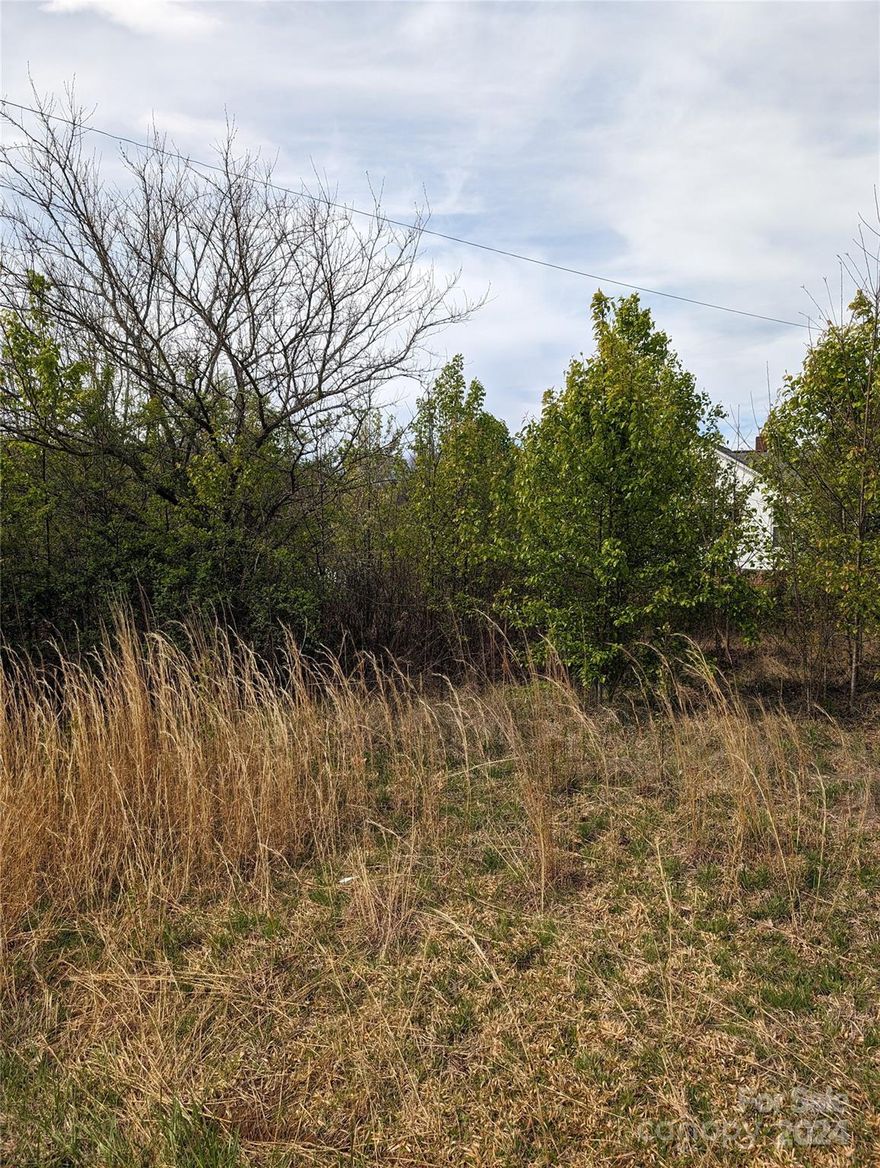 Welcome to your dream homesite! This stunning 1-acre lot offers the perfect canvas for building your ideal home. This spacious parcel of land boasts the convenience of water and sewer hookups available right at the road, simplifying the building process and enhancing your living experience. Easy access to I-40. There is a power pole currently on the property.