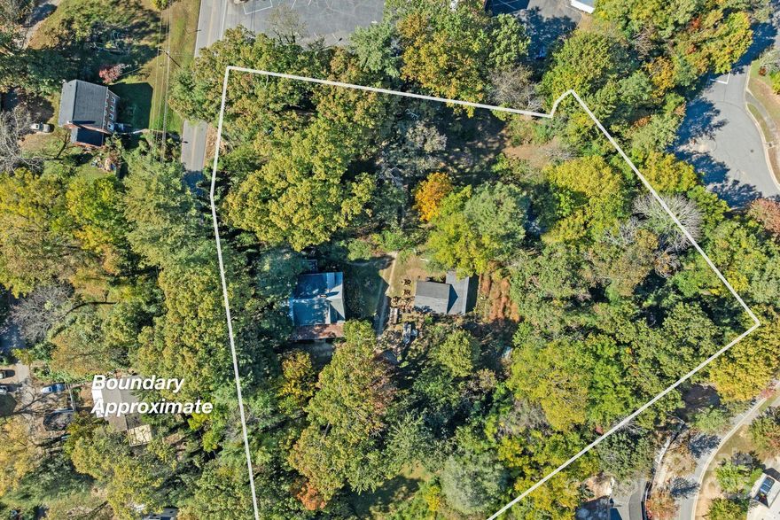 Prime RM-6 Development Opportunity in Kenilworth – 2.23 Acres with Vintage Home

Unlock the potential of 2.23 acres in Asheville’s highly desirable Kenilworth neighborhood, zoned RM-6 for medium-density residential development. This rare in-town parcel offers multiple paths to value (buyer to verify): subdivide for townhomes or cottage clusters, establish a tiny home community, or restore the existing 1927 brick Arts & Crafts residence as a family home or boutique bed & breakfast.


The existing home features original wood floors; built-ins; vintage windows; a deep, red ceramic tile front porch; and a second-story flex space with sink, range, and mini-fridge—ideal for guests or creative use. With Beaucatcher Road frontage, sewer access, and privacy in a central location just minutes from downtown Asheville, Mission Hospital, and Biltmore Village, this property offers both immediate utility and long-term upside. This property is ideal for developers, investors, or visionaries seeking a blend of classic charm and urban scalability.